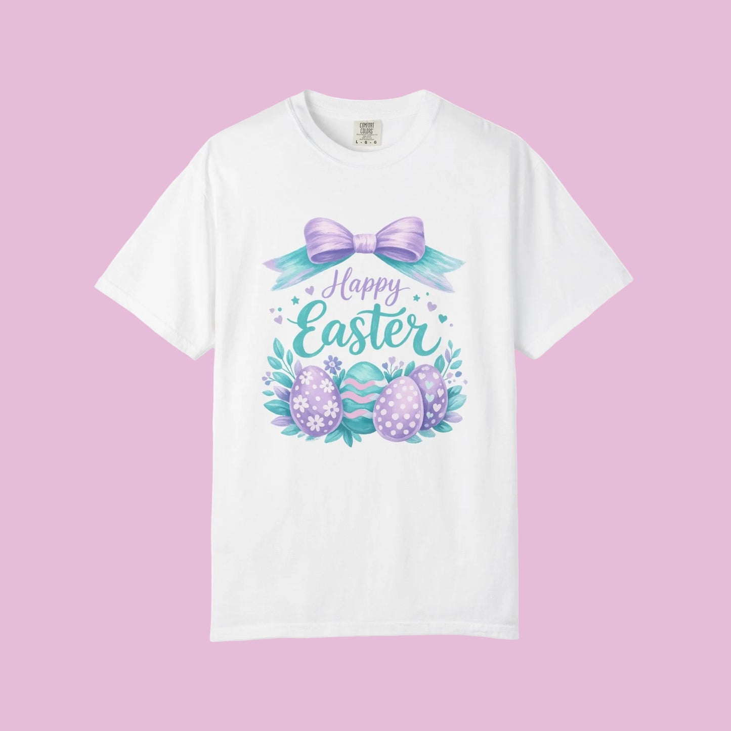 White t-shirt with Easter design featuring eggs and a bow on a white background