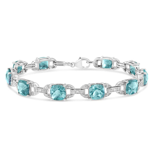 .925 Sterling Silver 7x7 mm Cushion Cut Blue Topaz and 1/20 cttw Round Cut Diamond Fashion Tennis Bracelet (I-J Color, I1-I2 Clarity) - 7" - (The Luxe Line)