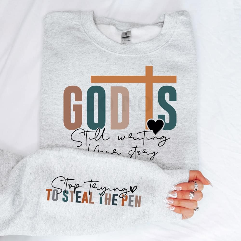 "God Is Still Writing Your Story" With Sleeve Accent Graphic Sweatshirt - Sweet PEA & Me Boutique